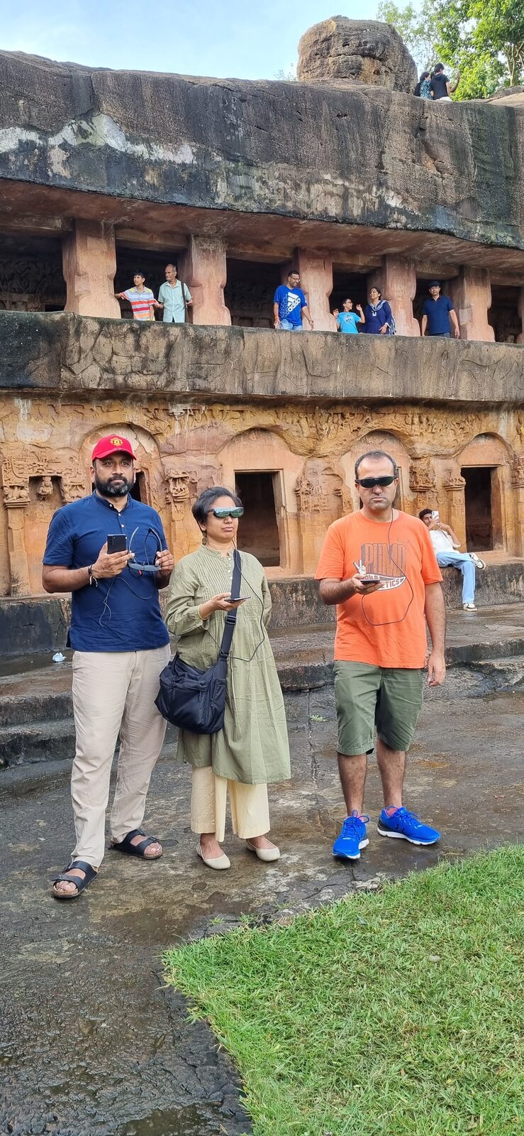 Visitor with AR glasses at Khandagiri cave carvings