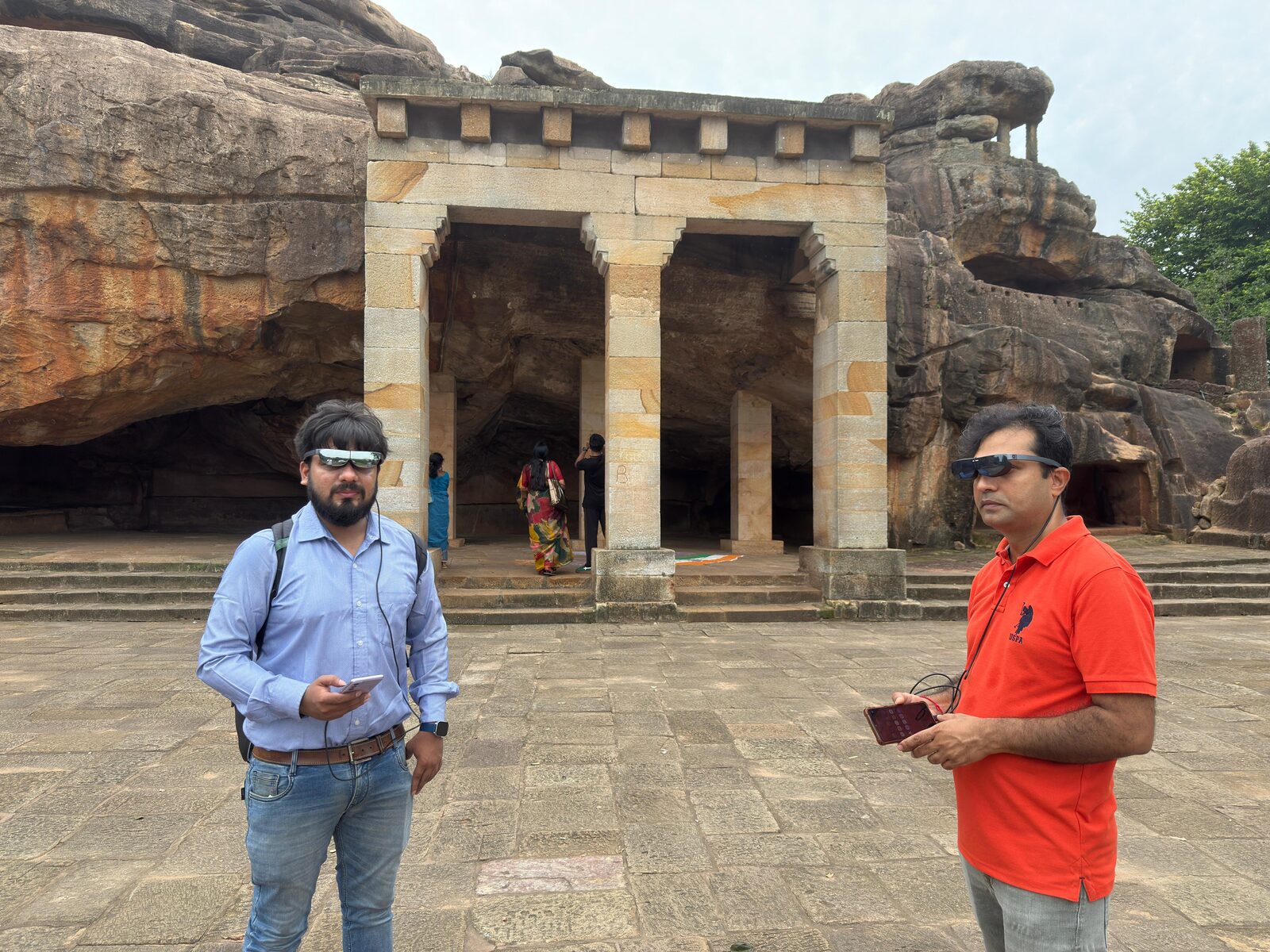 Visitors with AR glasses at Khandagiri cave entrance