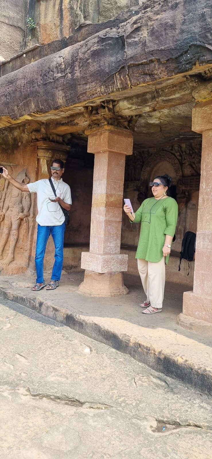 Visitors with AR glasses inside Khandagiri cave
