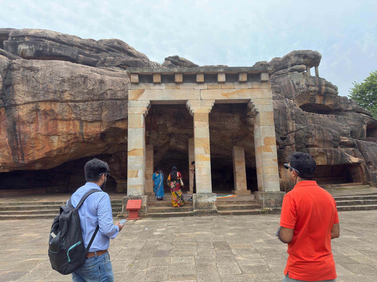 Visitors approaching Khandagiri cave entrance