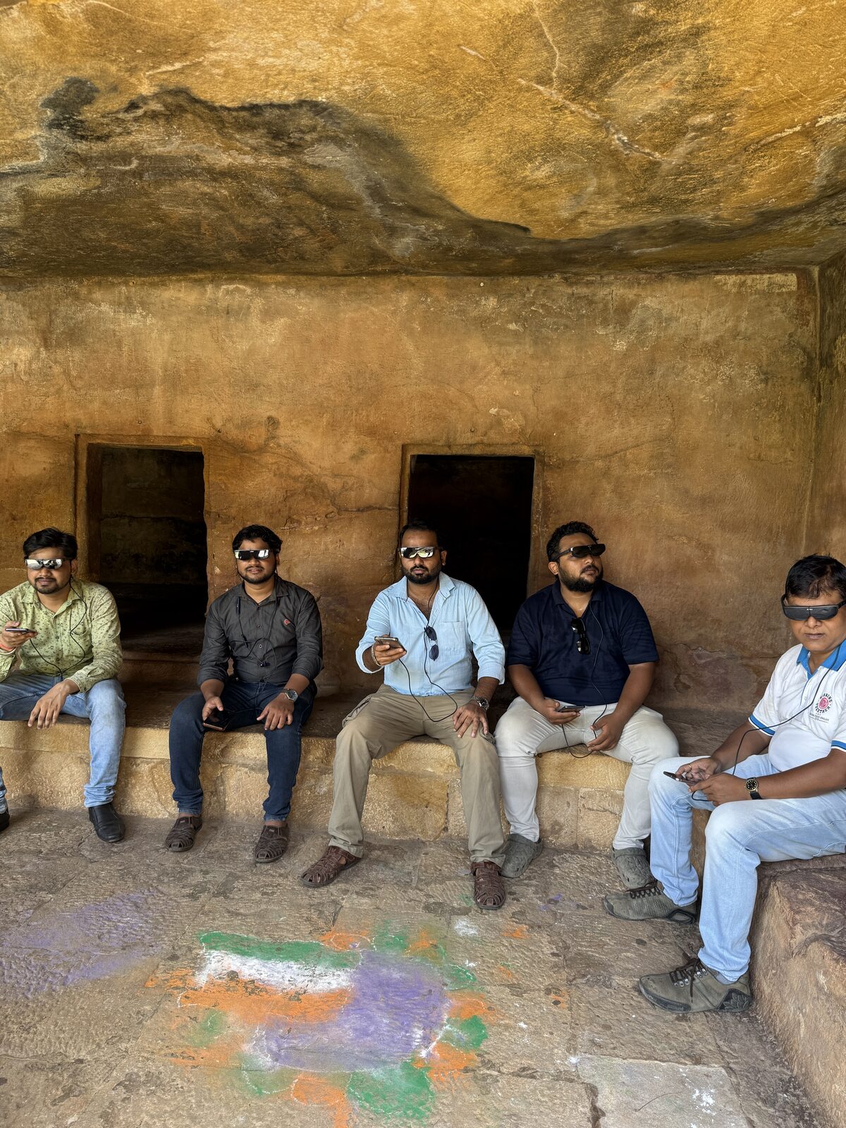Group tour inside Khandagiri cave chambers