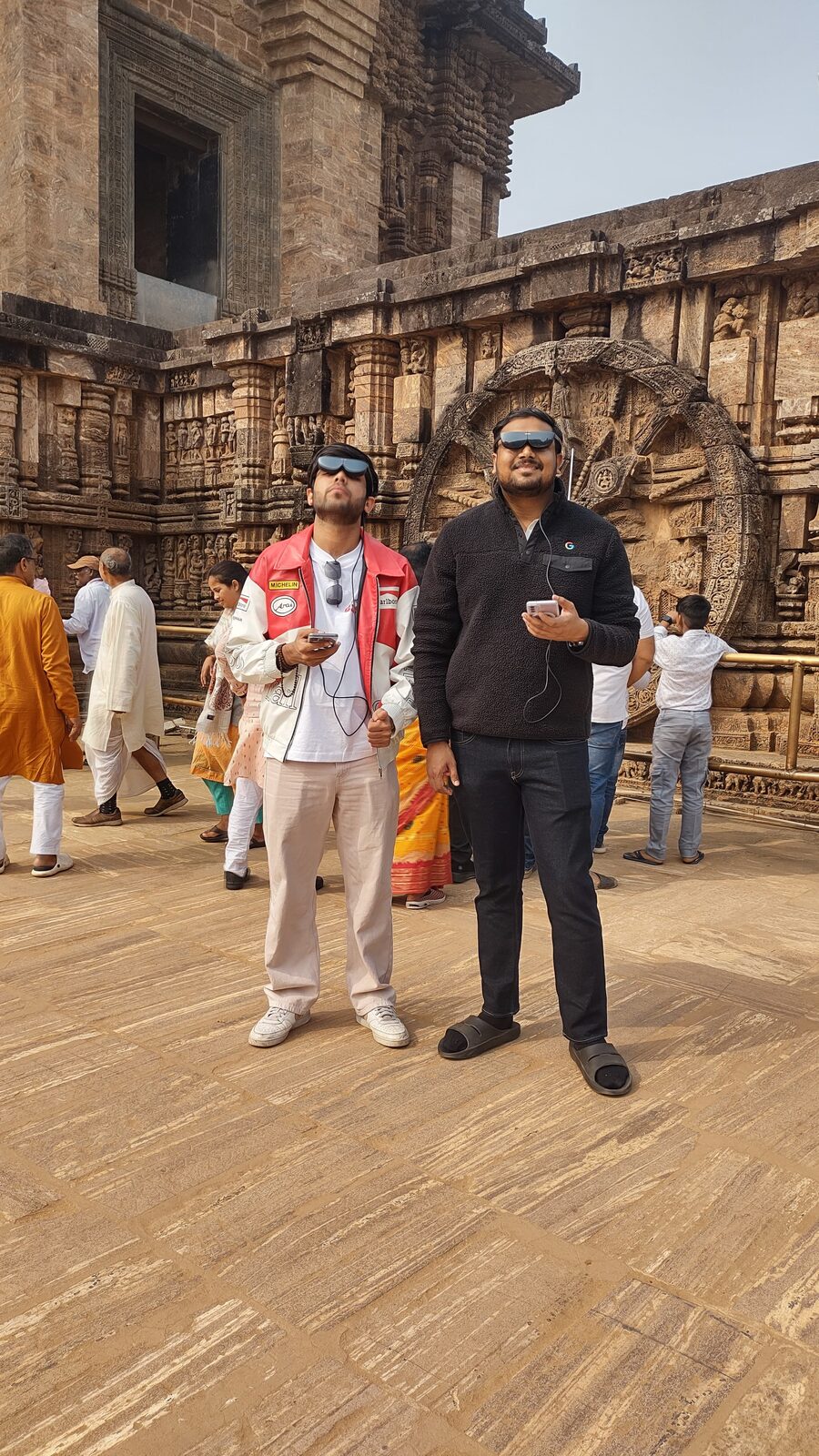 Two visitors wearing AR glasses at Konark temple