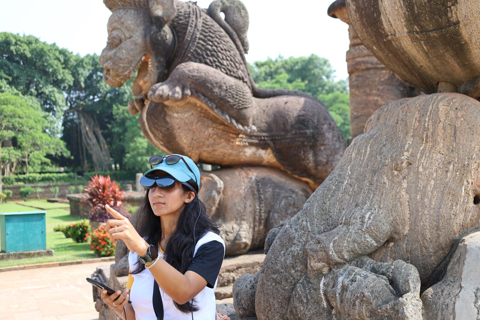 Visitor with AR glasses near lion sculpture at Konark Sun Temple