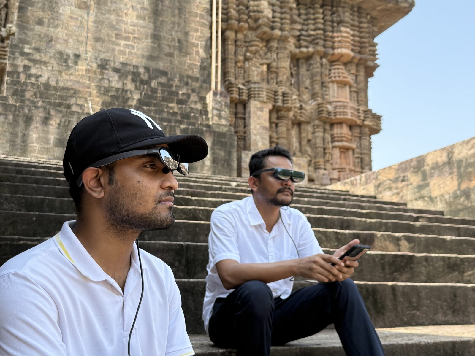 Visitors with AR glasses on the steps of Konark Sun Temple