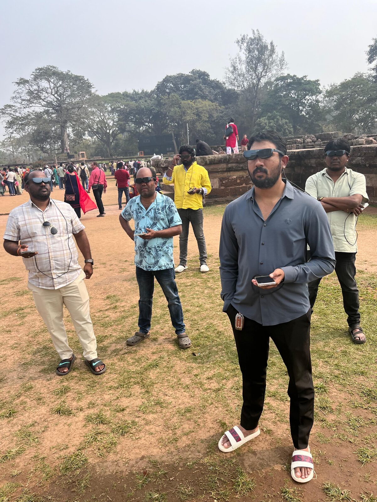 Visitors with AR glasses outdoors at Konark heritage site